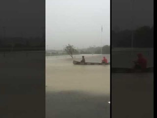 Cape Breton Residents Paddle a Canoe in Floods