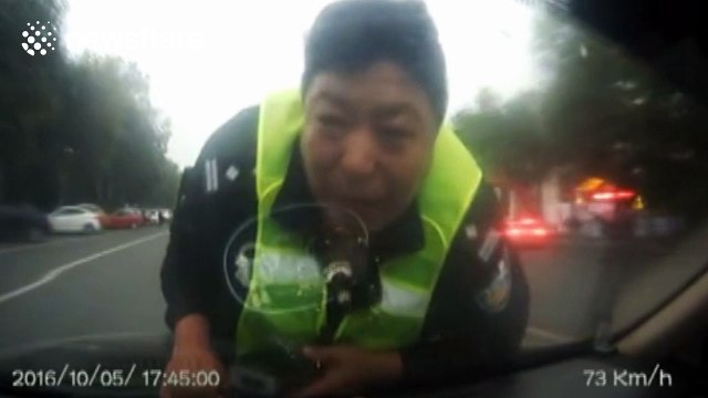 Runaway driver drags policeman on bonnet for 2 km