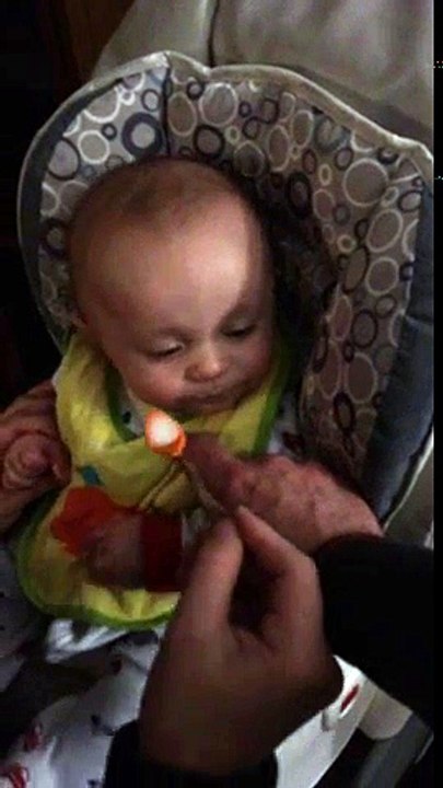 Baby Eating Cereal For The Very First Time