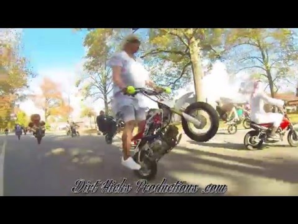 Motorcyclist Performs Wheelies on a 50CC Pit Bi...