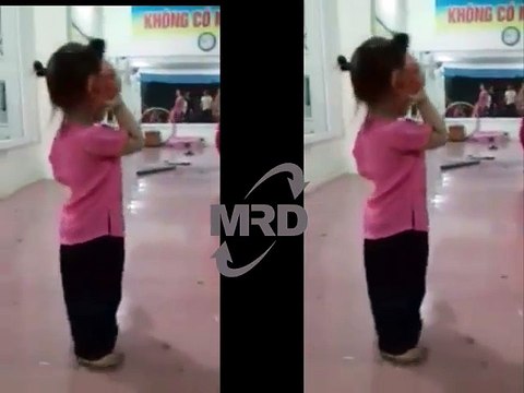 Girl baby Catching insects using a slipper in her classroom