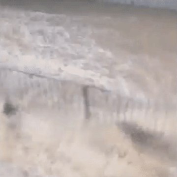Monsoon Turns Hong Kong Streets Into a Raging River