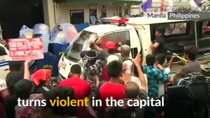 Philippine police van runs over protesters