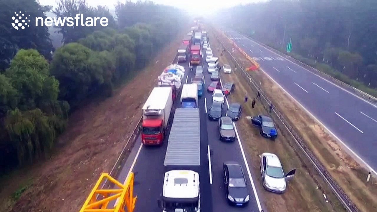 Extreme smog brings traffic to a standstill in Beijing