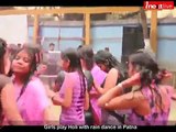 Girls play Holi with rain dance