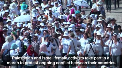 Female activists march near W.Bank city of Jericho