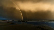 Timelapse Shows Double Rainbow as Sunset Storm Passes Over Ocean Grove