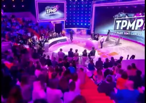 French journo slammed after kissing lady’s breast on live TV