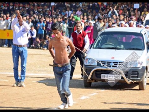 unbelievable TEENAGER PULLS TWO CARS USING HIS SHOULDER BLADES