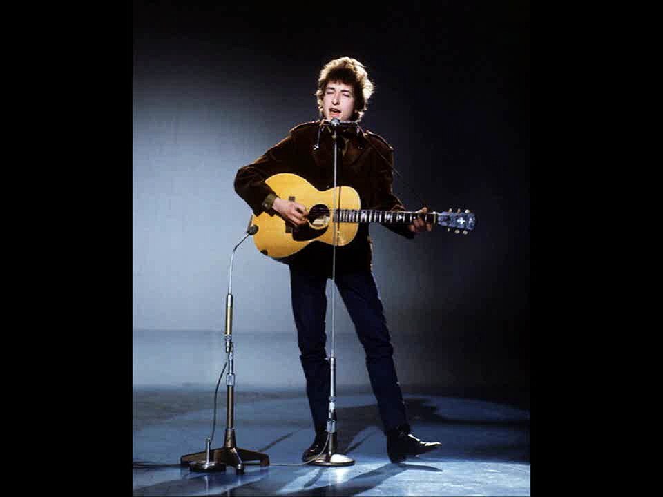 I met somebody face to face and I had to remove my hat  She’s everything I need and love but I can’t be swayed by that  It frightens me, the awful truth of how sweet life can be  But she ain’t a-gonna make me move, I guess it must be up to me