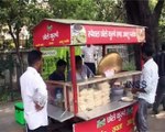 Milliner Woman Selling Foods On The Road of India