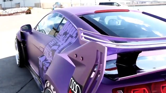 This Audi R8 has a wild body kit on it. Kind of reminds me of that Bugatti Vision GT car a little bit. =)