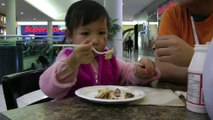 Girl Eating Cinnamon Roll