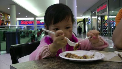 Girl Eating Cinnamon Roll