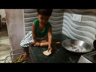 little baby making chapati