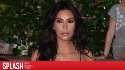 Kim Kardashian droht einer Autorin, die sagt ihr Überfall war "gestellt"