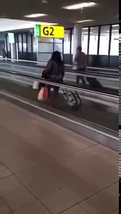 Woman Walking Upstream At The Airport!