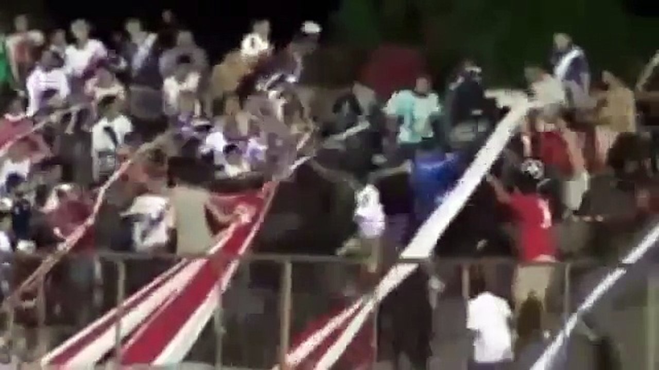 Football stadium erupts into violent brawl as rival hooligans clash and fan beat