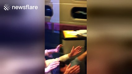 Amazing elderly woman does the paquito and a headstand on French train