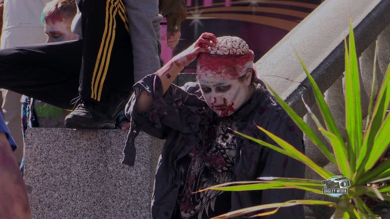 Zombie picks brain and eats it at Halifax Zombie Walk
