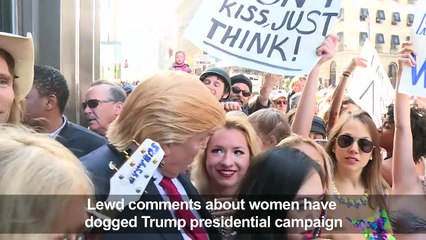 Bikini-clad models surround fake Trump in NYC stunt