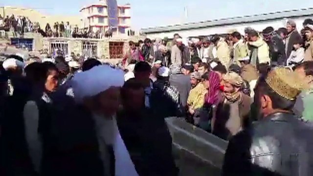 Afghans mourn civilians abducted and killed by IS militants