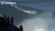 Sebastian Steudtner rides giant wave in Nazare, Portugal