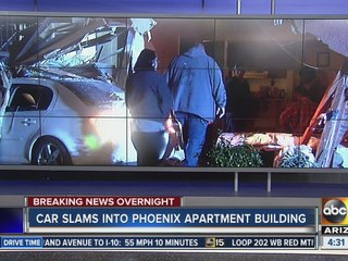 Car slams into Phoenix apartment building