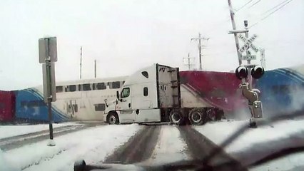 Double decker train smashes through FedEx truck