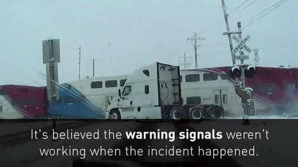 Double decker train smashes through FedEx truck