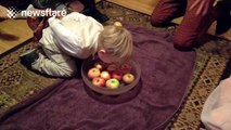 Boy, 3, tries apple bobbing for Halloween, fails
