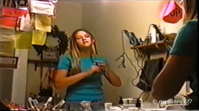 girl gets her long hair cut to a short micro bob haircut