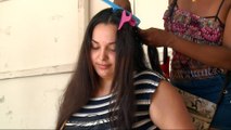 Venezuelan women sell hair to buy food