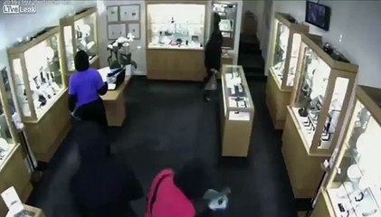 Three masked men robbing a jewelry store
