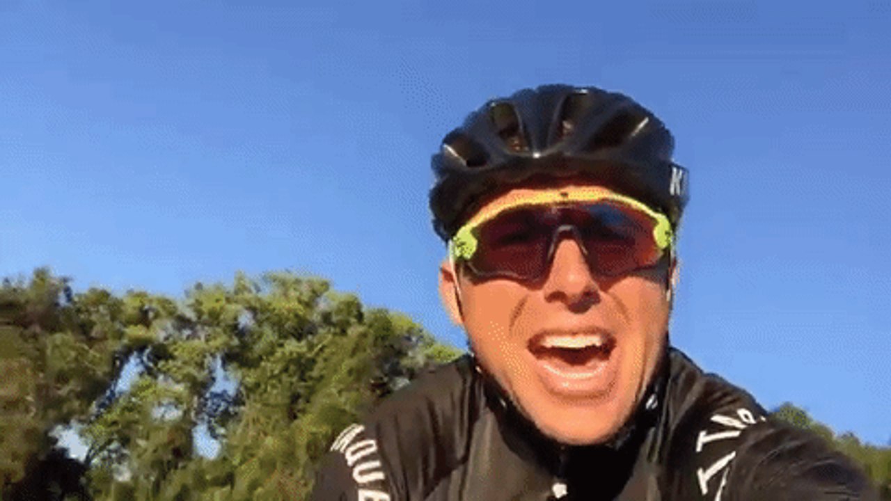 Bike Rider in Disbelief of Magpie's Relentless Assault