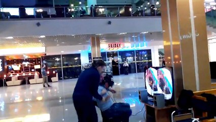 A Russian trying the helmet Oculus Rift in a store