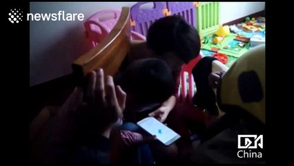 Boy, 2, gets his head stuck in a chair