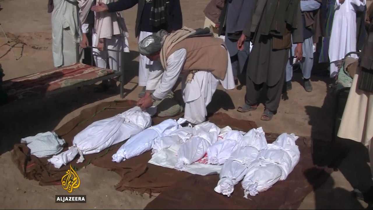 Mourners bury Afghan civilians killed in NATO bombing