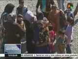 Iraquíes se reúnen con sus familias en Khazer, tras huir del Daesh