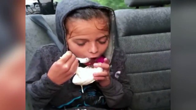 Shivering Girl Devours Ice Cream in the Freezing Rain