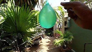 Watch in Slow motion how a water balloon bursts