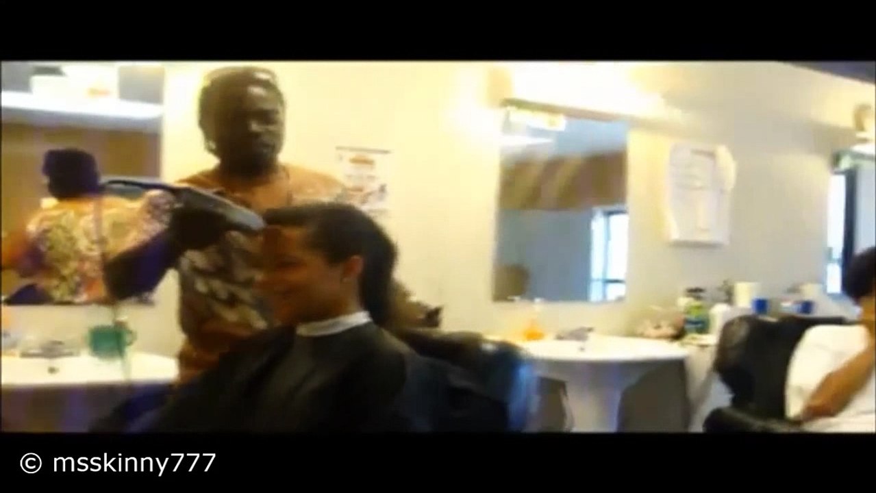 girl gets her head shaved at the barbershop