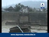 China floods: Shocking visuals of how a house collapses