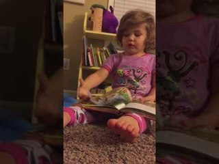 Adorable Girl Reads Bedtime Story to Her Dad