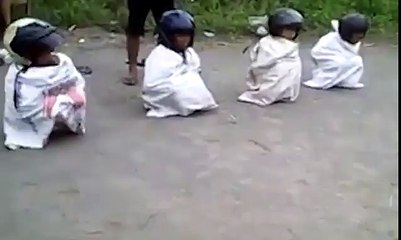 Amazing Sack Race Between Kids Wearing Helmet