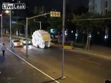 Overloaded tricycle moving through downtown street