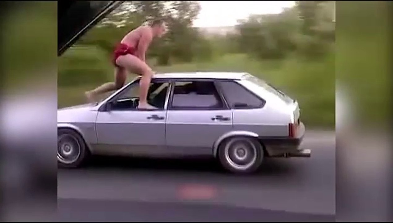 Boy Comes Out on the roof of moving car - Shocking Footage