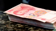 Moeda chinesa em mínimos de oito anos face ao dólar