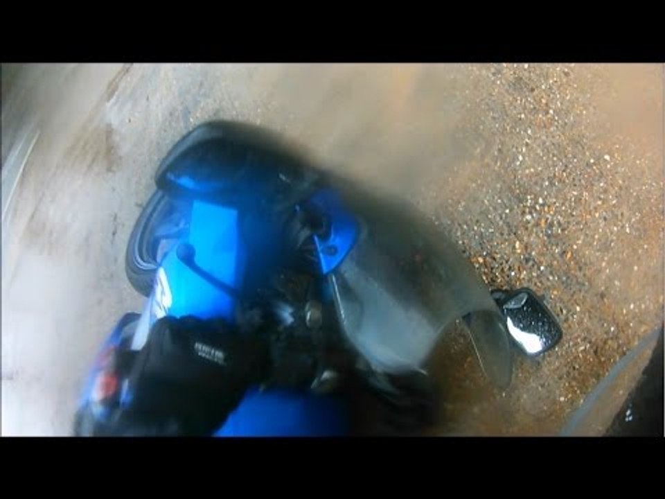 Motorcyclist Tips Over at Roundabout