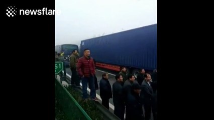 Group of women, stuck in six-hour traffic jam, dance on motorway
